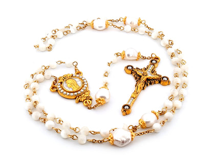 Virgin Mary unique rosary beads mother of pearl and fresh water pearl rosary with gold plated pearl sunburst crucifix.