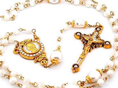 Virgin Mary unique rosary beads mother of pearl and fresh water pearl rosary with gold plated pearl sunburst crucifix.