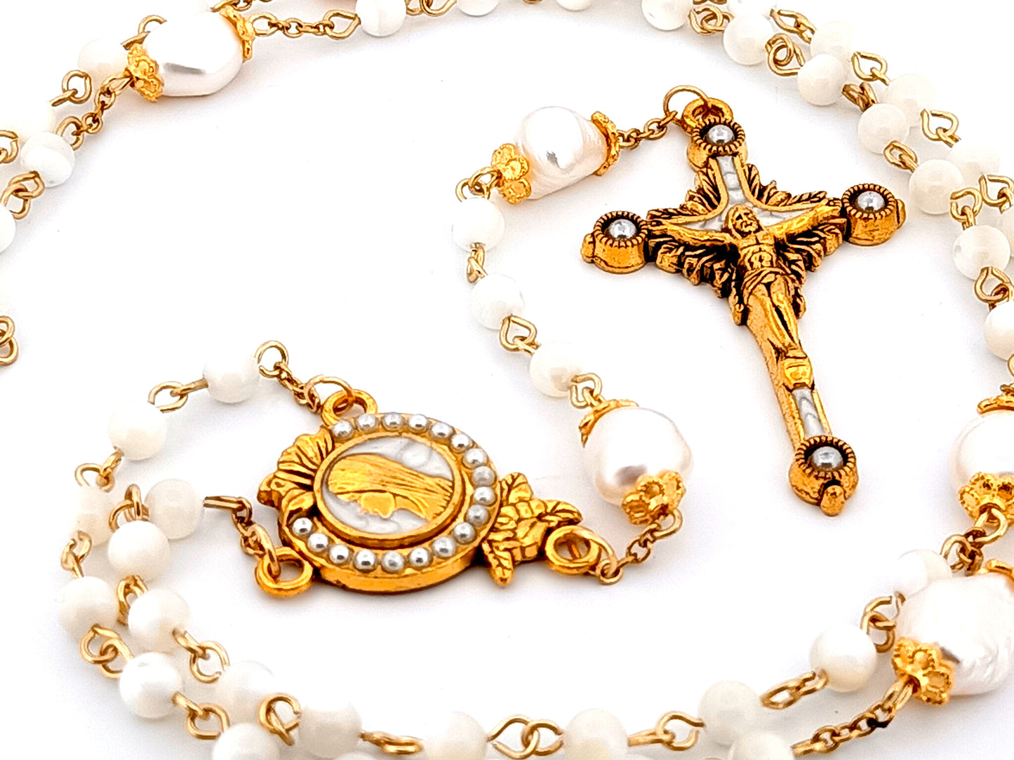 Virgin Mary unique rosary beads mother of pearl and fresh water pearl rosary with gold plated pearl sunburst crucifix.
