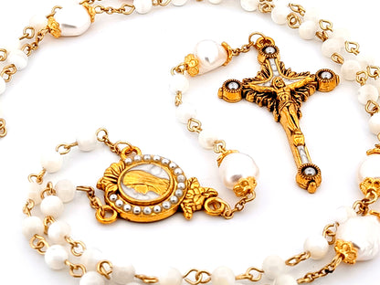 Virgin Mary unique rosary beads mother of pearl and fresh water pearl rosary with gold plated pearl sunburst crucifix.