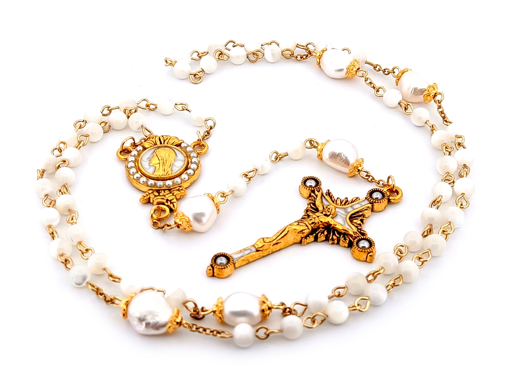 Virgin Mary unique rosary beads mother of pearl and fresh water pearl rosary with gold plated pearl sunburst crucifix.
