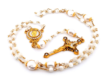 Virgin Mary unique rosary beads mother of pearl and fresh water pearl rosary with gold plated pearl sunburst crucifix.