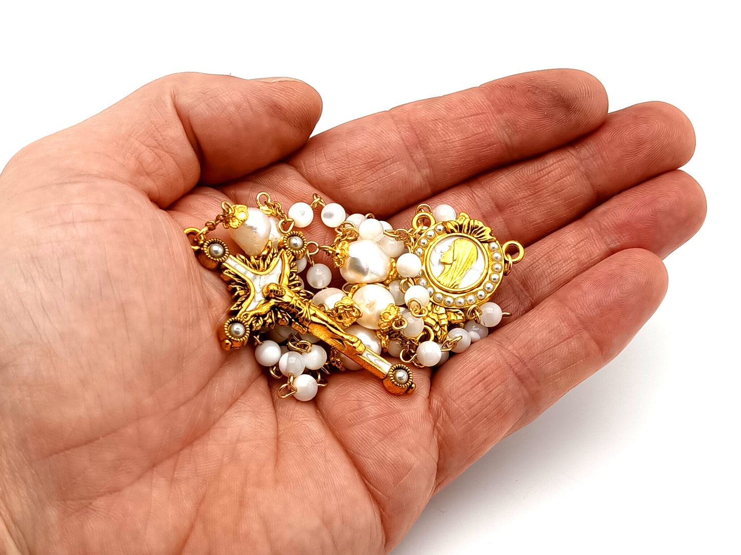 Virgin Mary unique rosary beads mother of pearl and fresh water pearl rosary with gold plated pearl sunburst crucifix.