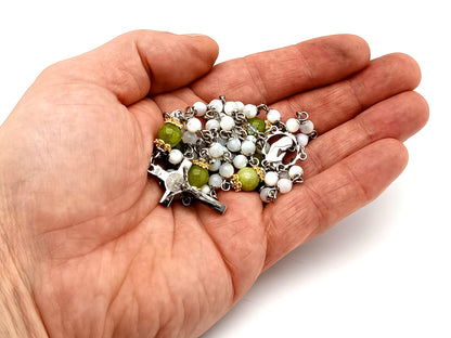 Virgin Mary unique rosary beads mother of pearl and peridot gemstone rosary with stainless steel Saint Benedict crucifix.