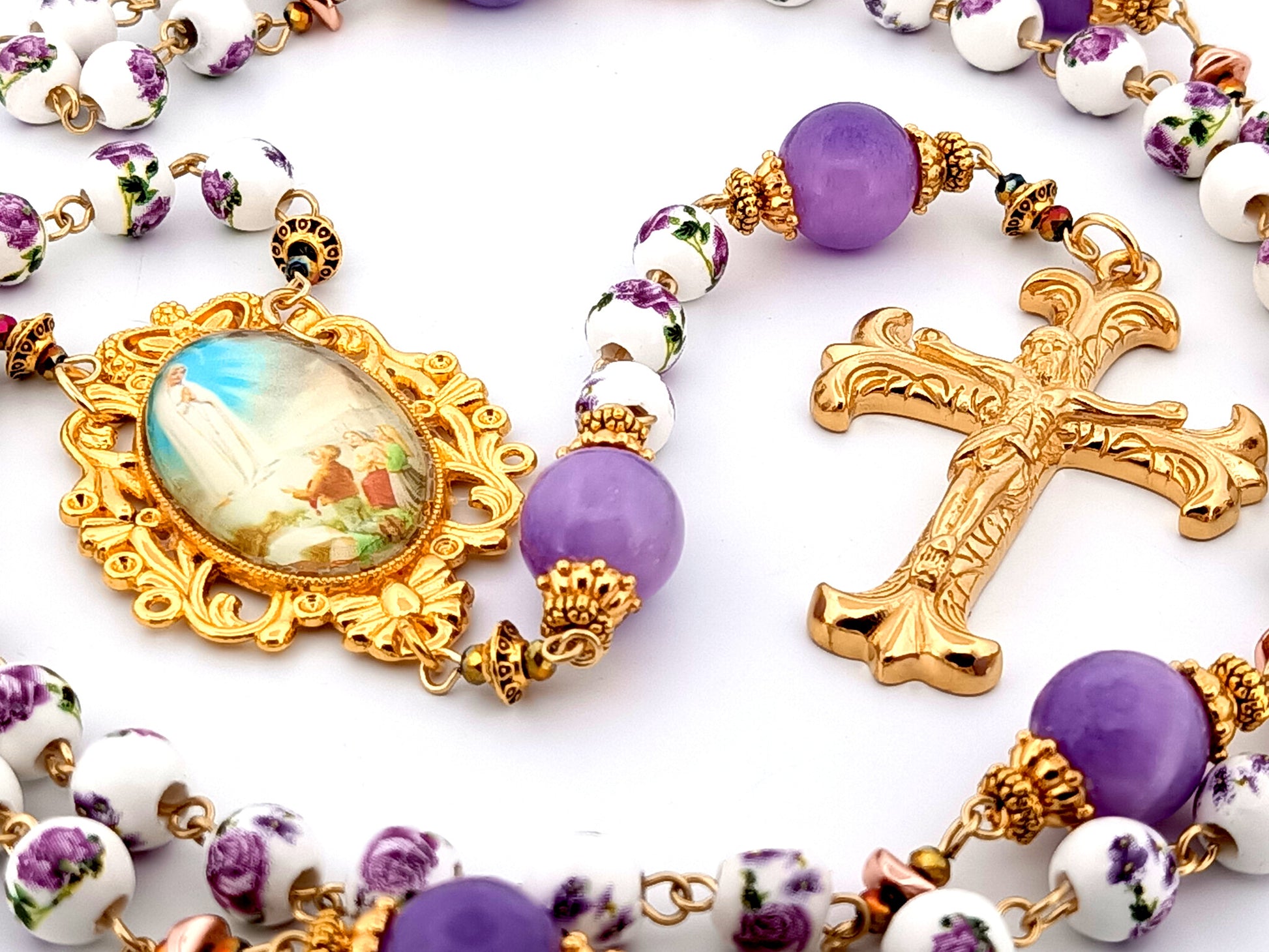 Our Lady of Fatima unique rosary beads porcelain and purple glass rosary with gold plated Fleur de Lys crucifix.