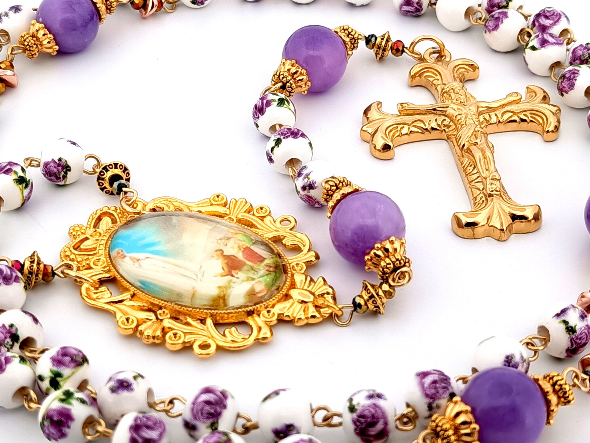 Our Lady of Fatima unique rosary beads porcelain and purple glass rosary with gold plated Fleur de Lys crucifix.