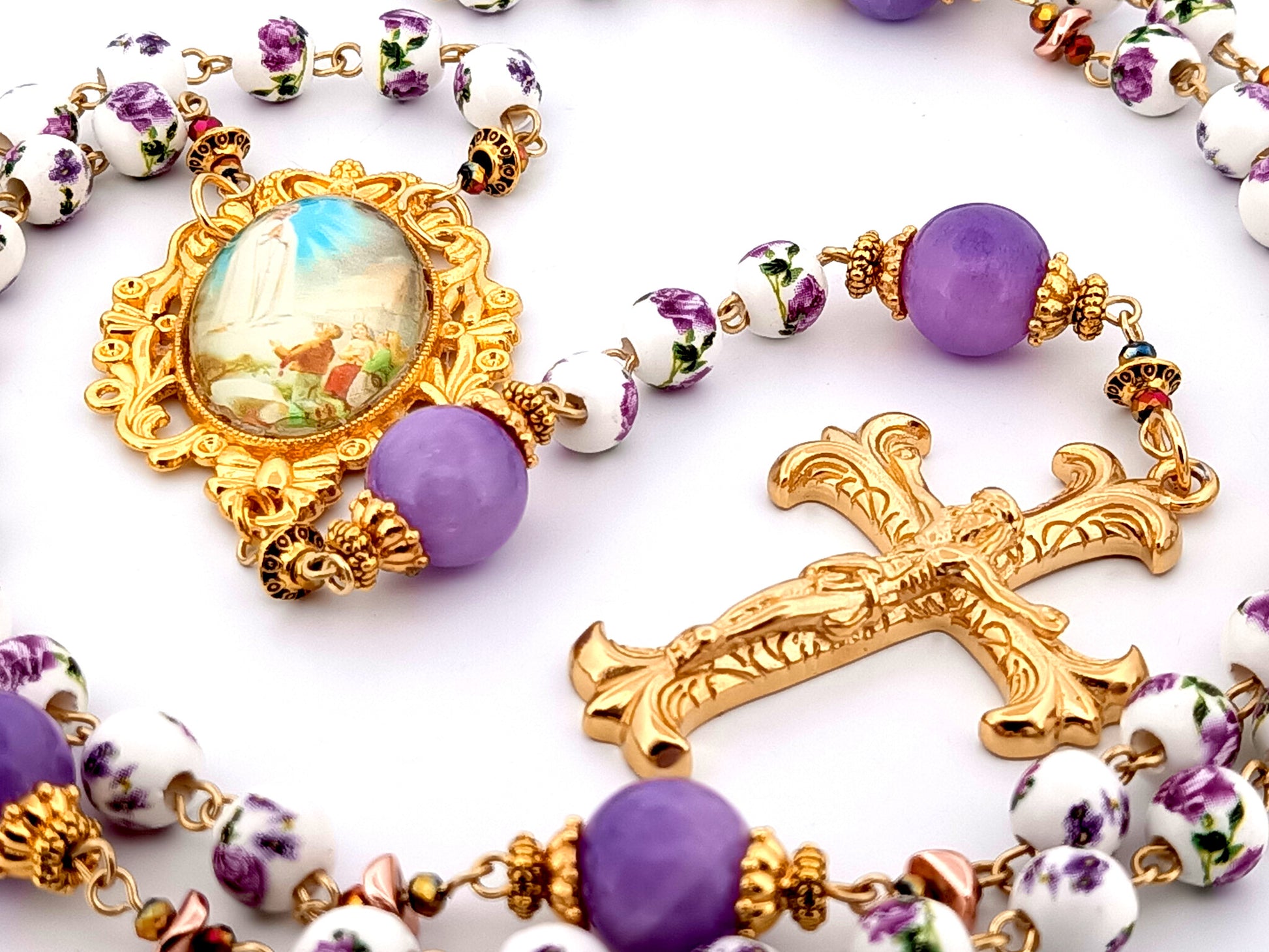 Our Lady of Fatima unique rosary beads porcelain and purple glass rosary with gold plated Fleur de Lys crucifix.