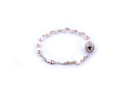 Natural pearl and 925 sterling silver single decade rosary bracelet with mother of pearl cross.