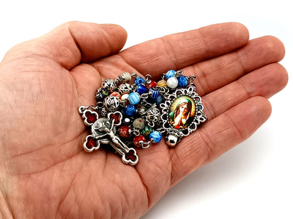 Virgin Mary unique rosary beads millefiori glass and silver rosary beads with red enamel crucifix.