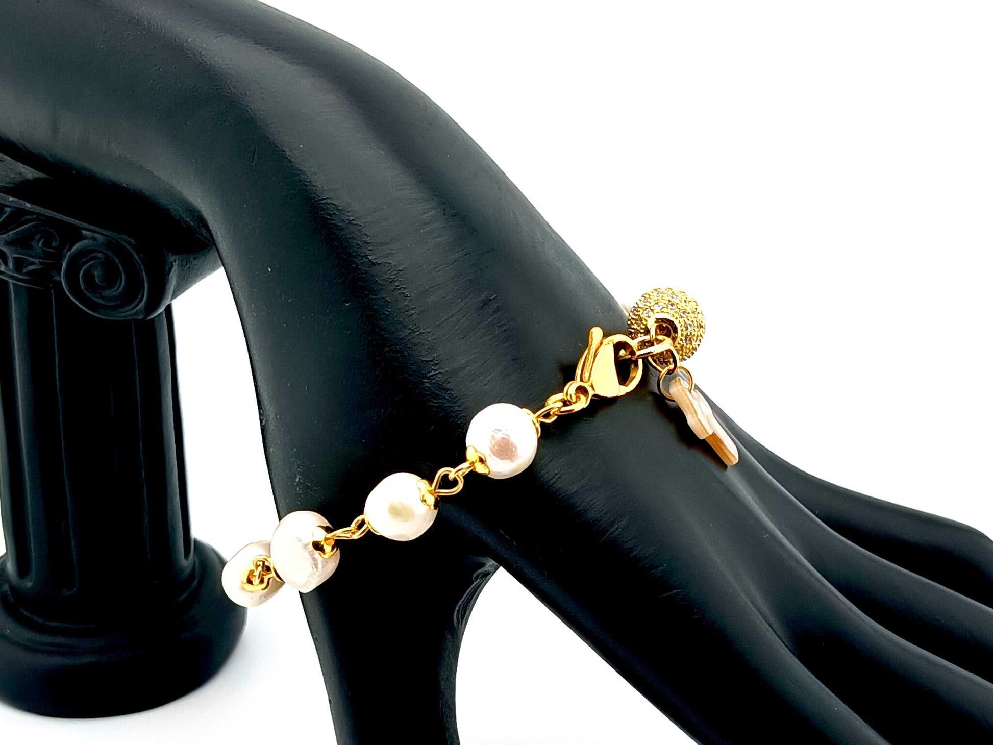 Mother of Pearl cross single decade rosary bracelet with freshwater pearls and 18K gold plated cubic zirconia beads.