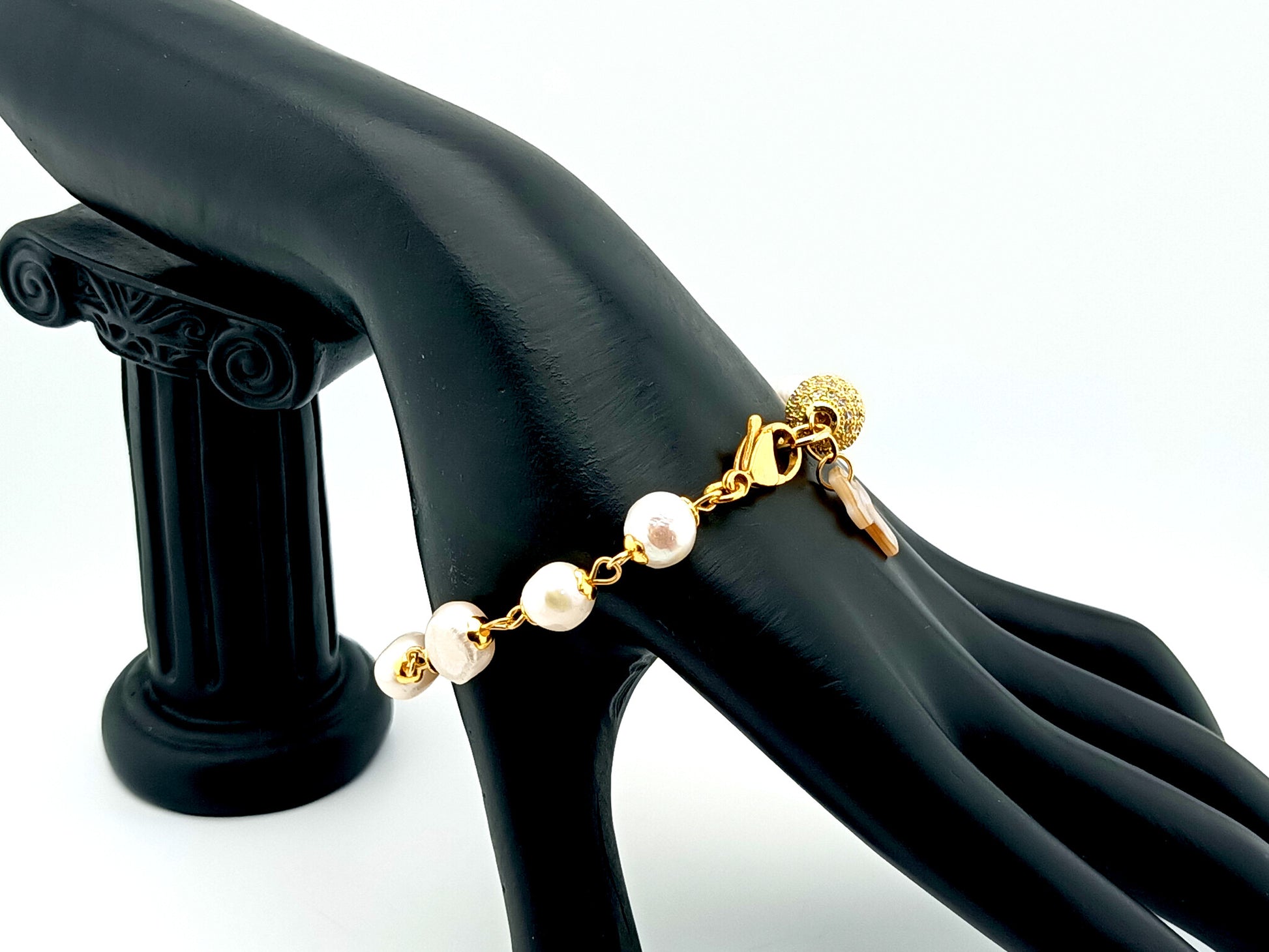 Mother of Pearl cross single decade rosary bracelet with freshwater pearls and 18K gold plated cubic zirconia beads.