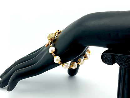 Mother of Pearl cross single decade rosary bracelet with freshwater pearls and 18K gold plated cubic zirconia beads.