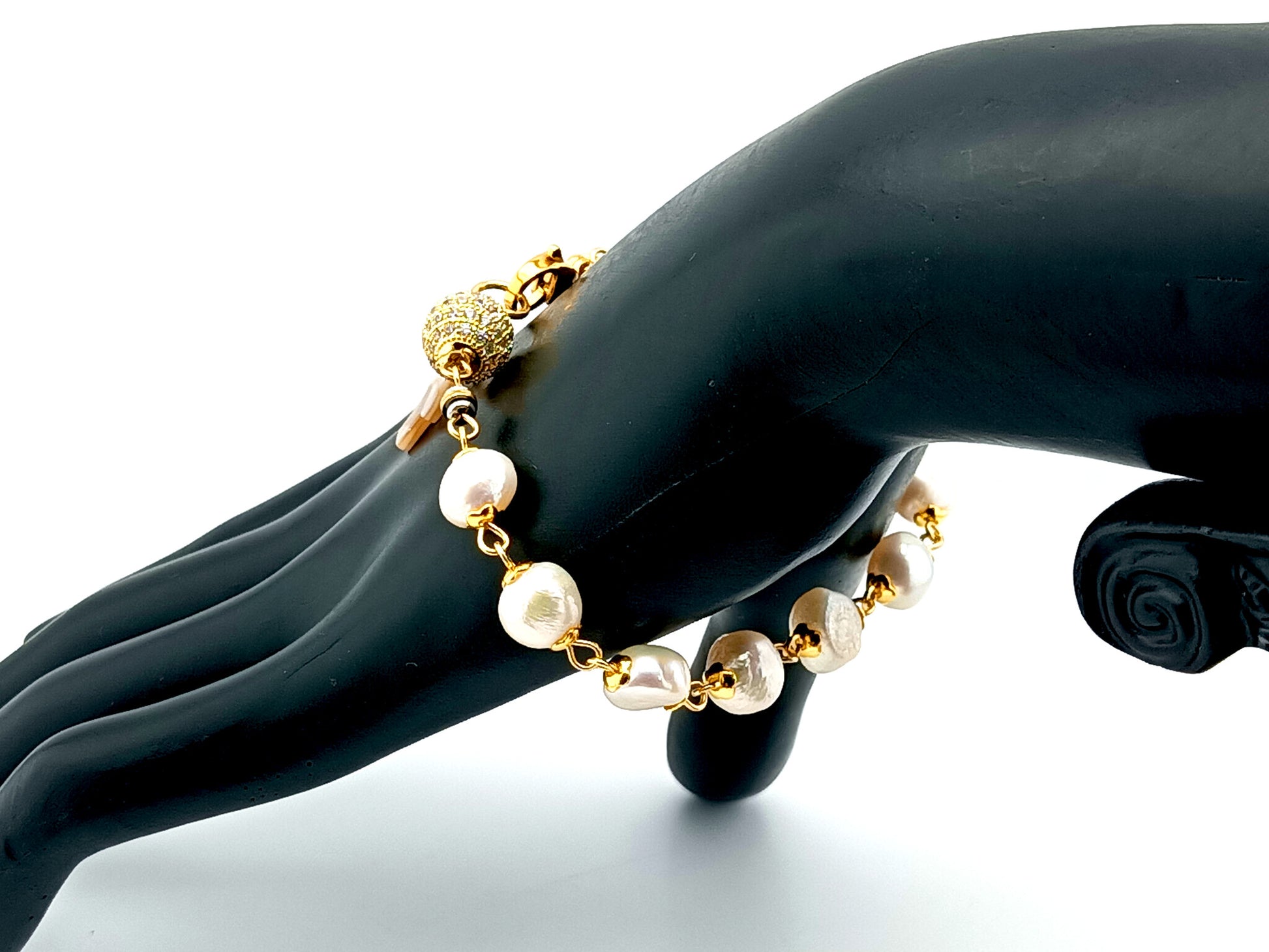 Mother of Pearl cross single decade rosary bracelet with freshwater pearls and 18K gold plated cubic zirconia beads.