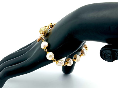 Mother of Pearl cross single decade rosary bracelet with freshwater pearls and 18K gold plated cubic zirconia beads.