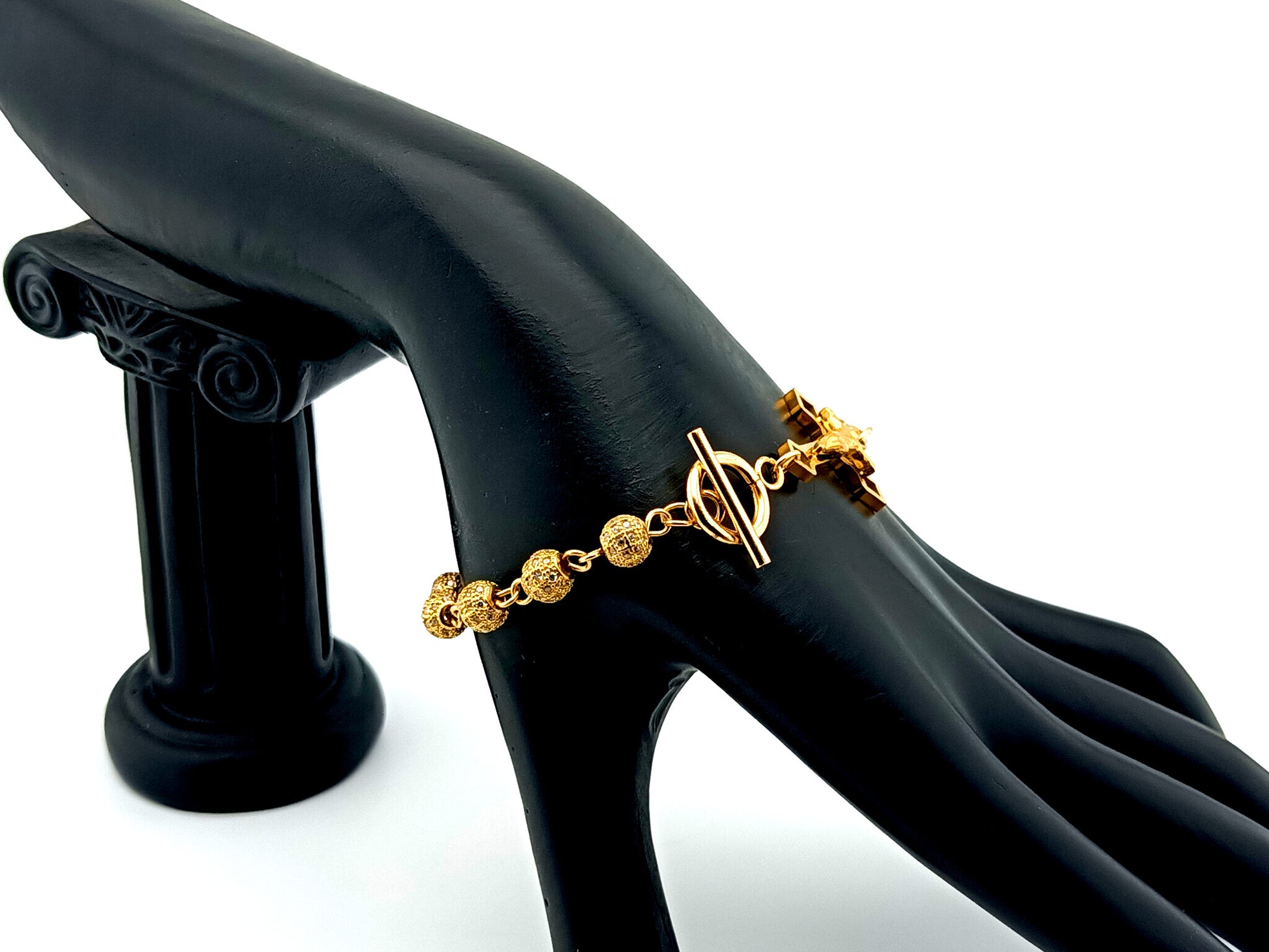 18K Gold cubic zirconia single decade rosary bracelet with gold plated Saint Benedict crucifix.