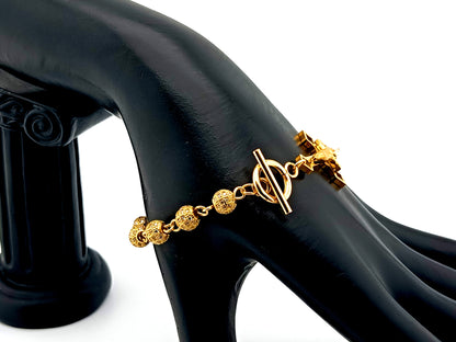 18K Gold cubic zirconia single decade rosary bracelet with gold plated Saint Benedict crucifix.