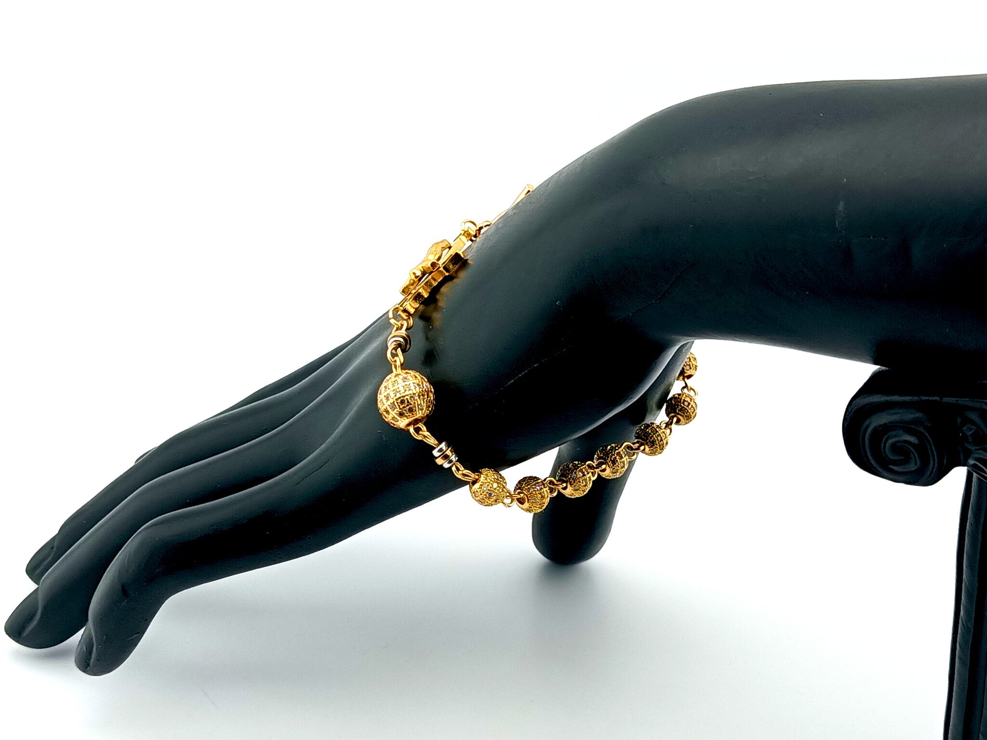 18K Gold cubic zirconia single decade rosary bracelet with gold plated Saint Benedict crucifix.