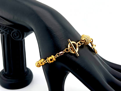 18K gold plated 925 sterling silver Miraculous medal and cubic zirconia single decade rosary bead bracelet with small gold plated cross.