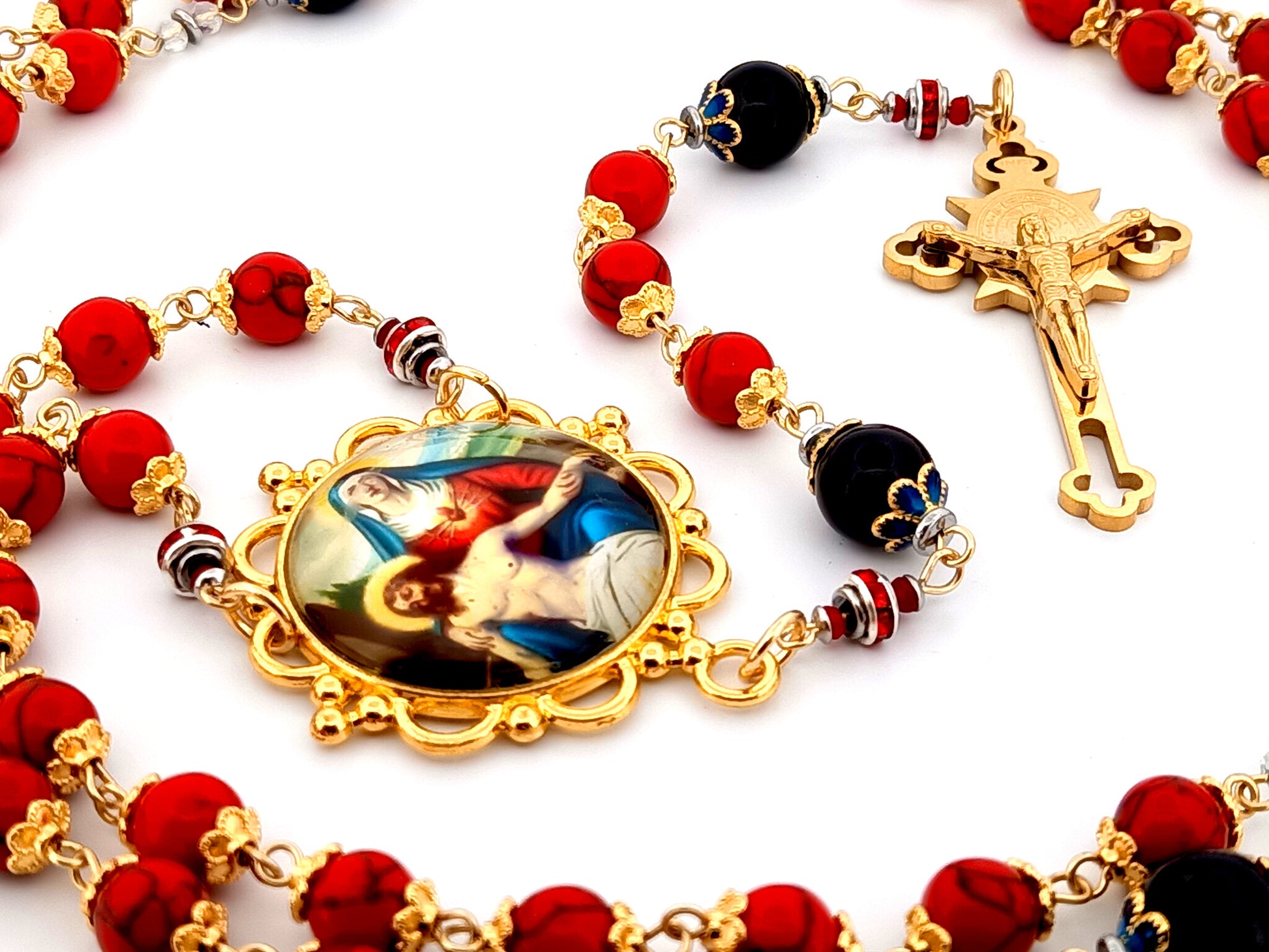 Our Lady of Sorrows unique rosary beads howlite and onyx gemstone rosary with gold plated Saint Benedict crucifix.