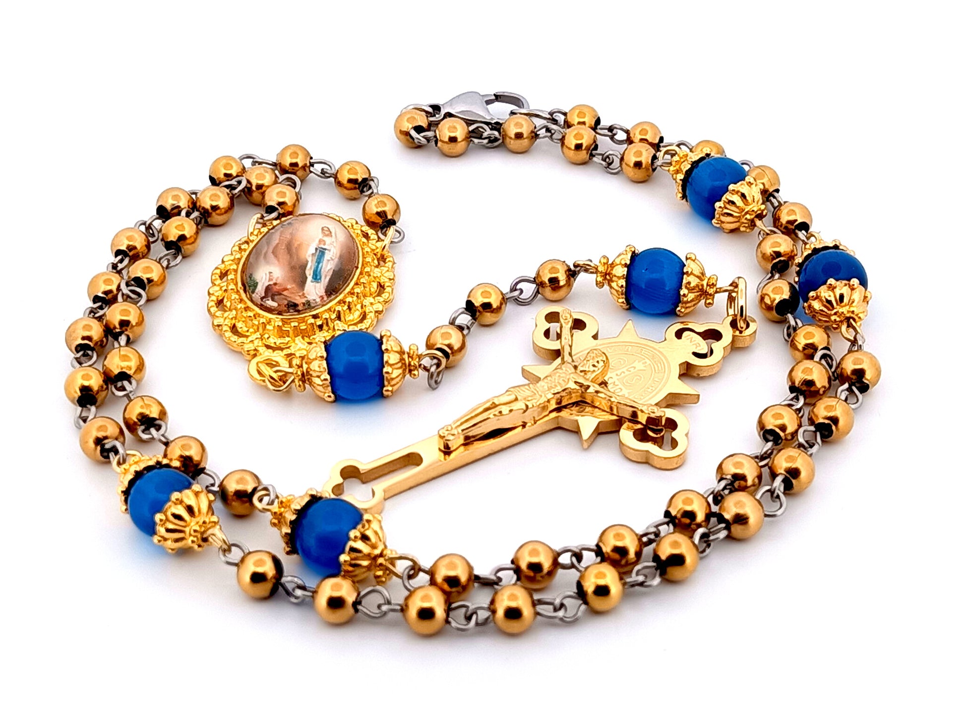 Our Lady of Lourdes unique rosary beads gold plated stainless steel and blue cats eye glass rosary with gold plated Saint Benedict crucifix.