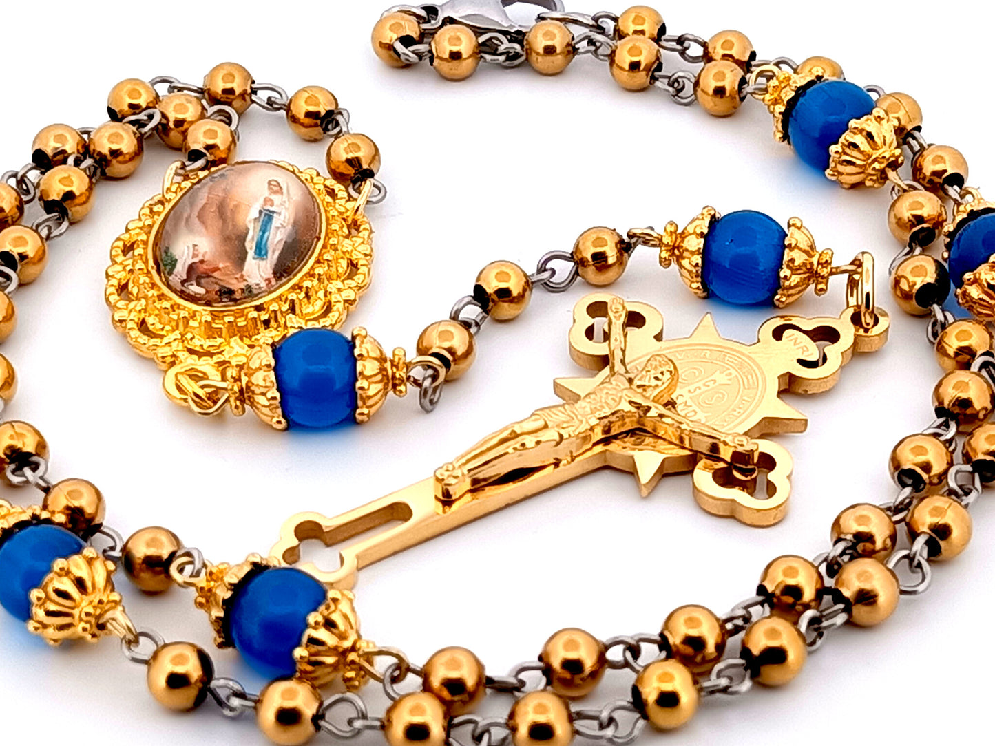 Our Lady of Lourdes unique rosary beads gold plated stainless steel and blue cats eye glass rosary with gold plated Saint Benedict crucifix.