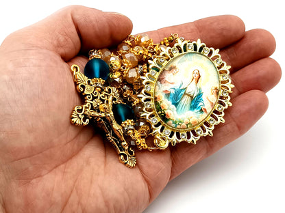Assumption of Our Lady unique rosary beads rose gold faceted and blue glass beads with gold plated filigree crucifix.