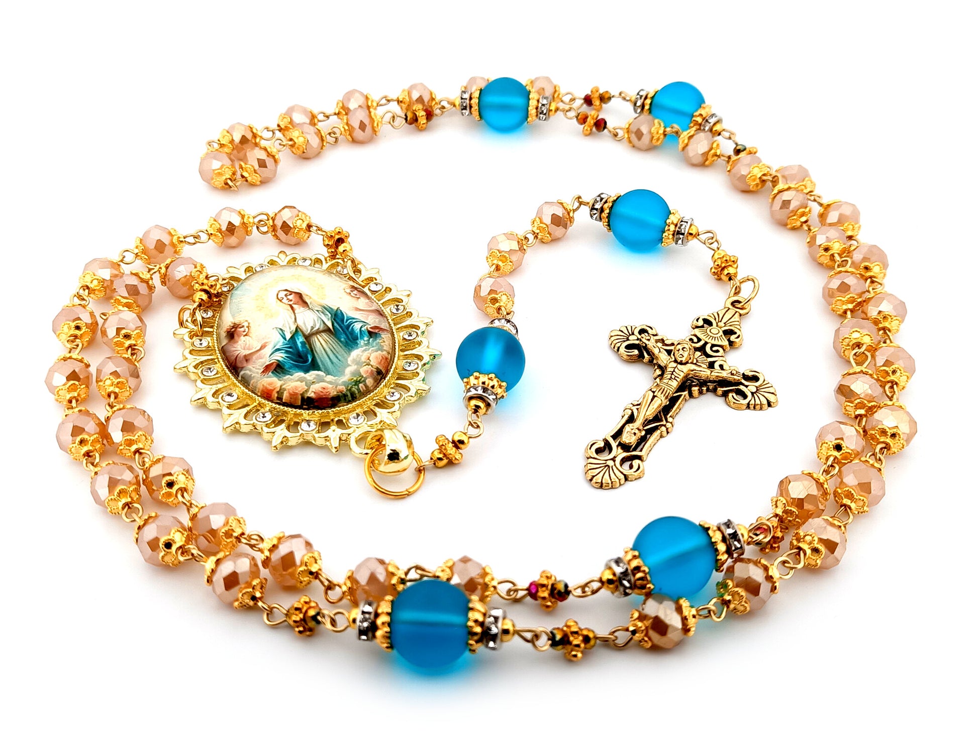 Assumption of Our Lady unique rosary beads rose gold faceted and blue glass beads with gold plated filigree crucifix.