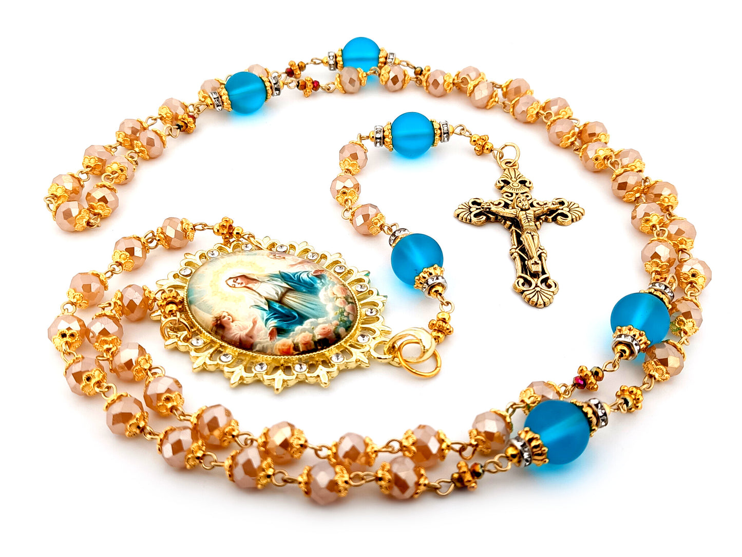 Assumption of Our Lady unique rosary beads rose gold faceted and blue glass beads with gold plated filigree crucifix.