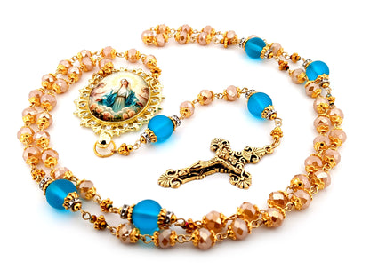 Assumption of Our Lady unique rosary beads rose gold faceted and blue glass beads with gold plated filigree crucifix.