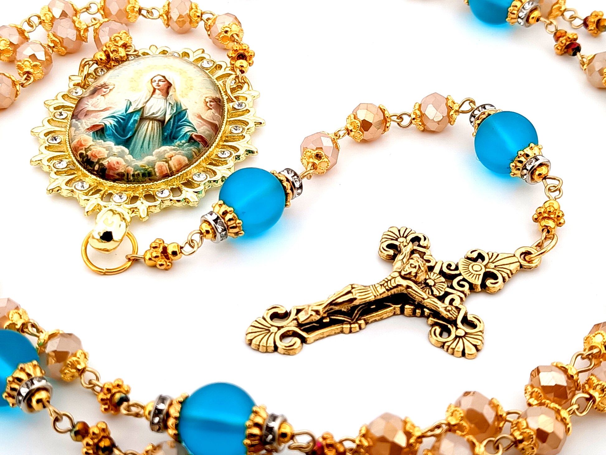 Assumption of Our Lady unique rosary beads rose gold faceted and blue glass beads with gold plated filigree crucifix.