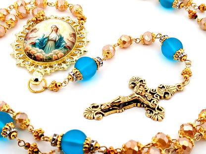 Assumption of Our Lady unique rosary beads rose gold faceted and blue glass beads with gold plated filigree crucifix.