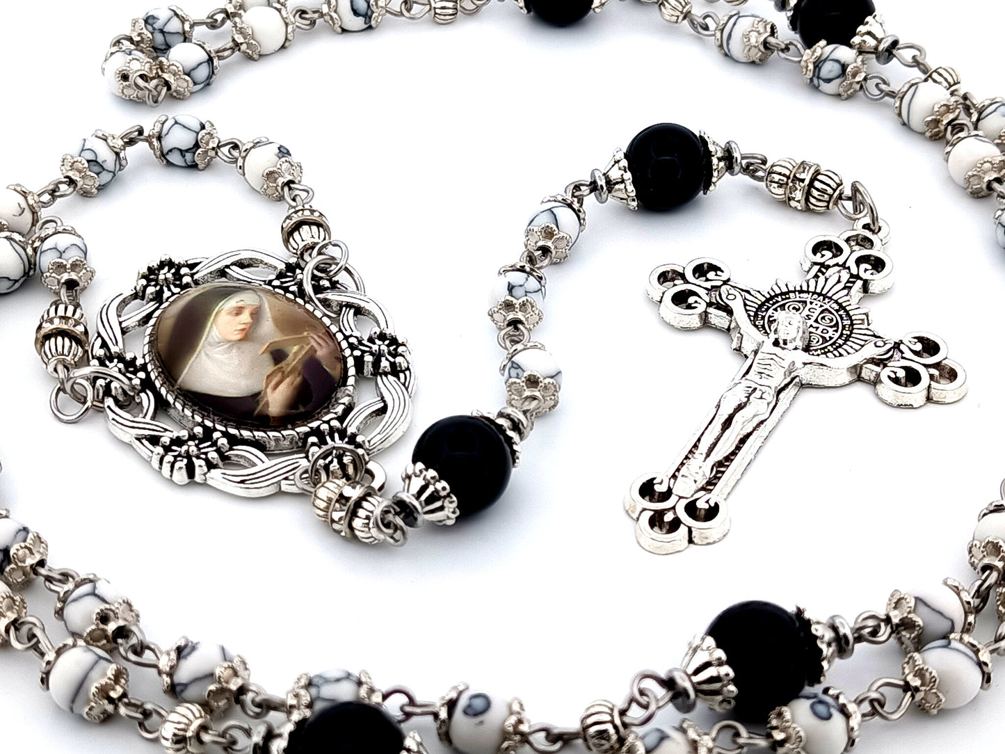 Saint Rita unique rosary beads howlite and onyx gemstone rosary with Saint Benedict crucifix.