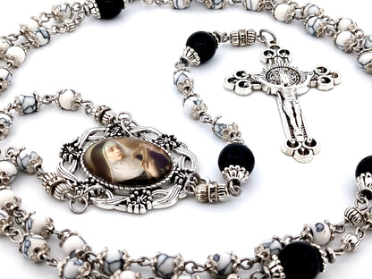Saint Rita unique rosary beads howlite and onyx gemstone rosary with Saint Benedict crucifix.