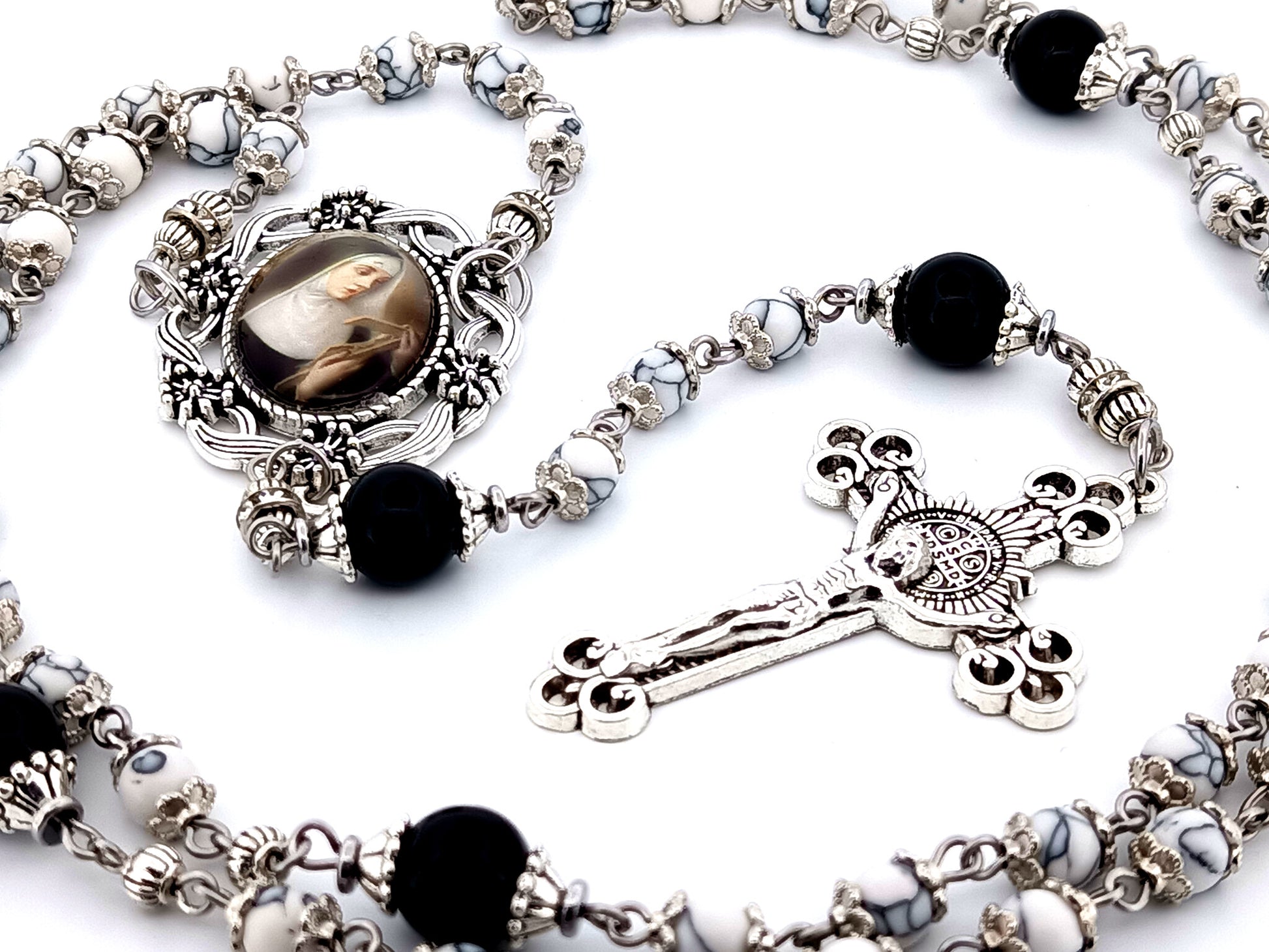 Saint Rita unique rosary beads howlite and onyx gemstone rosary with Saint Benedict crucifix.
