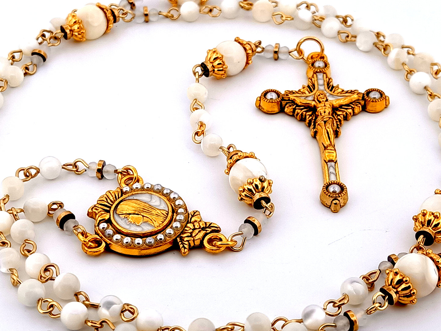 Virgin Mary unique rosary beads mother of pearl rosary with gold plated pearl sunburst crucifix.