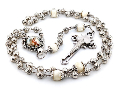 Our Lady Praying silver and mother of pearl unique rosary beads with stainless steel Saint Benedict crucifix.