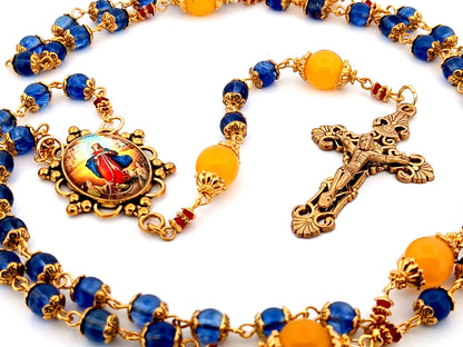 Our Lady Undoer of Knots blue and pale orange glass unique rosary beads with gold plated filigree crucifix.