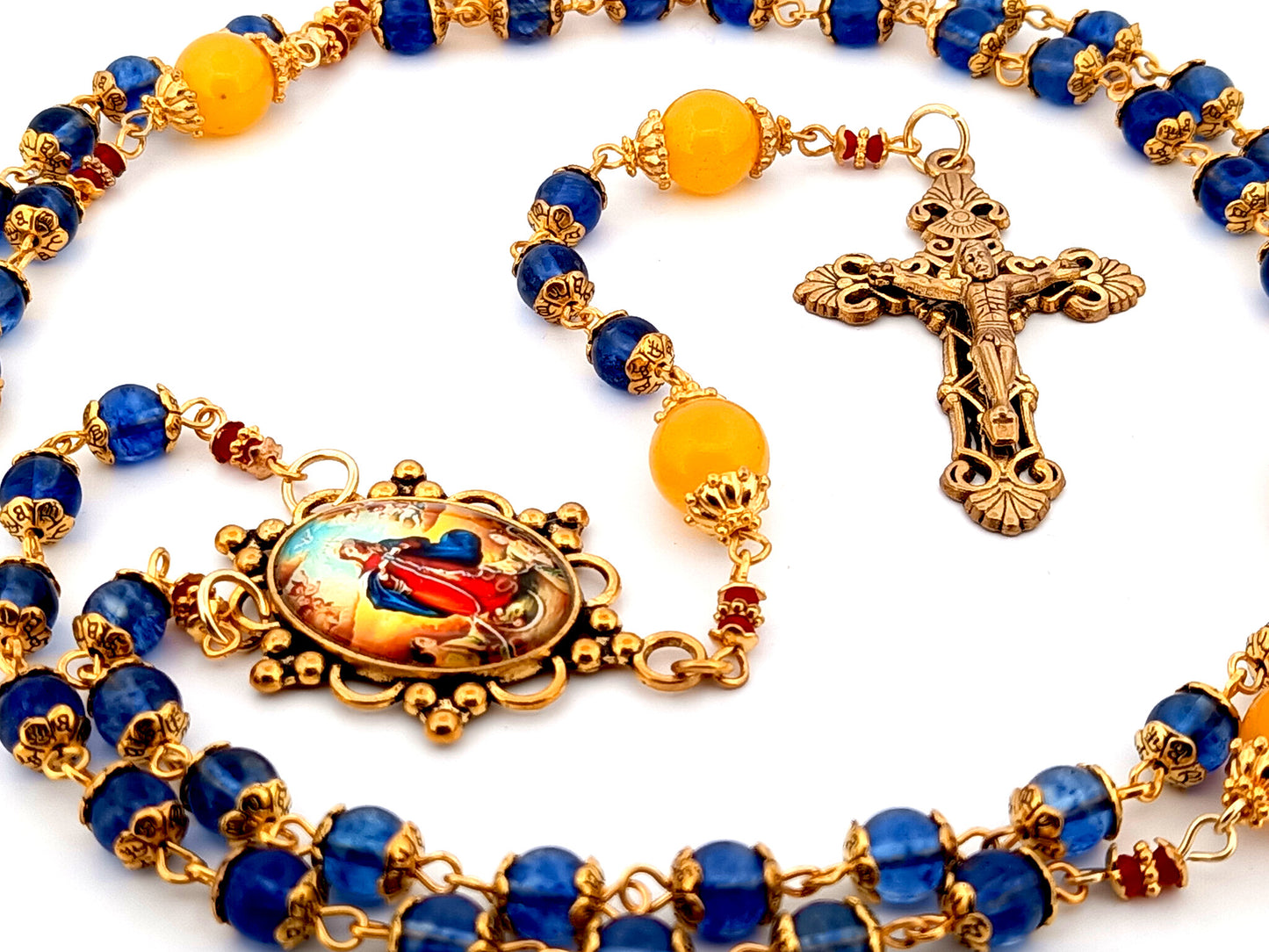 Our Lady Undoer of Knots blue and pale orange glass unique rosary beads with gold plated filigree crucifix.