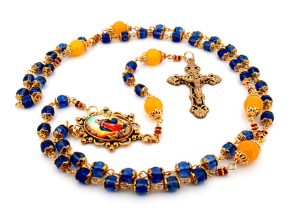 Our Lady Undoer of Knots blue and pale orange glass unique rosary beads with gold plated filigree crucifix.