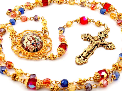 Our Lady of Perpetual Succour multi coloured faceted glass rosary beads with gold plated filigree crucifix.