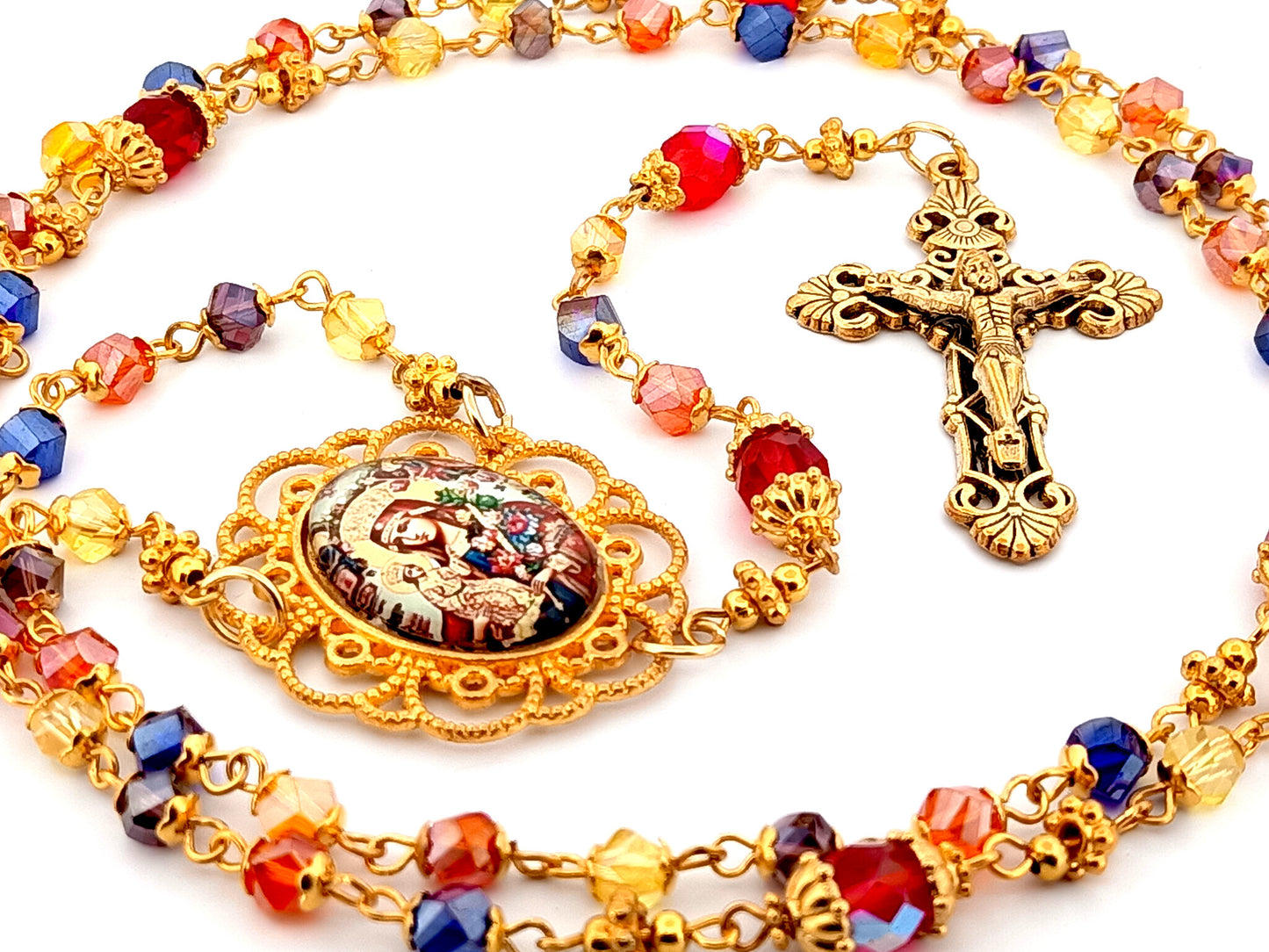 Our Lady of Perpetual Succour multi coloured faceted glass rosary beads with gold plated filigree crucifix.