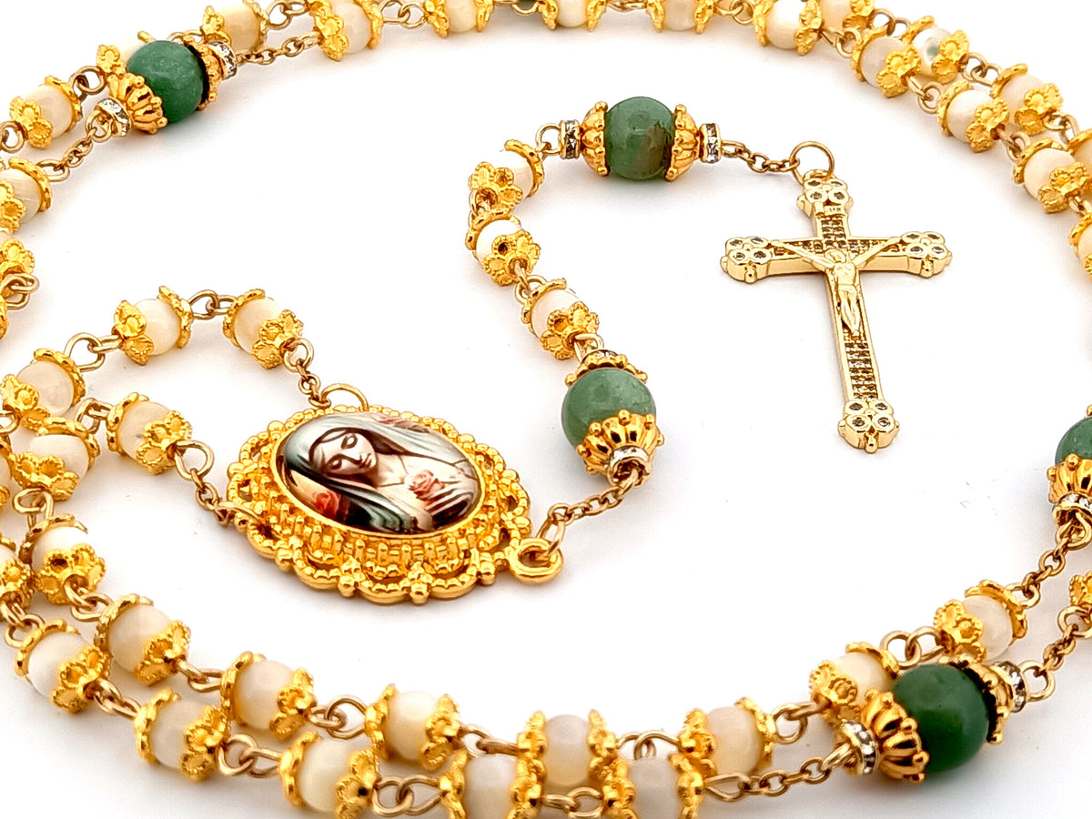 Virgin Mary mother of pearl and peridot gemstone unique rosary beads with 18K gold plated cubic zirconia crucifix.