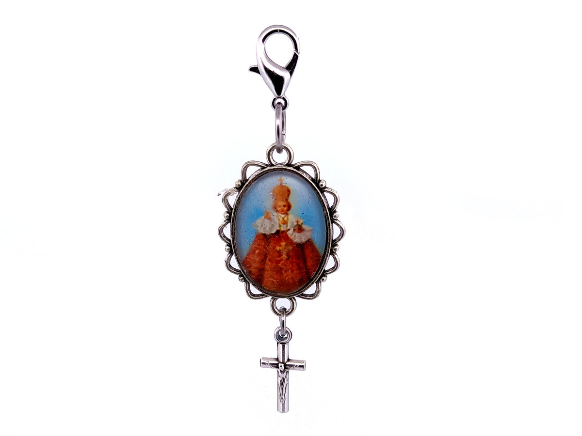 Infant of Prague domed picture medal key fob with small crucifix.