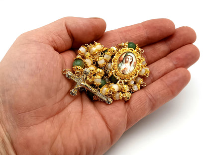 Virgin Mary mother of pearl and peridot gemstone unique rosary beads with 18K gold plated cubic zirconia crucifix.