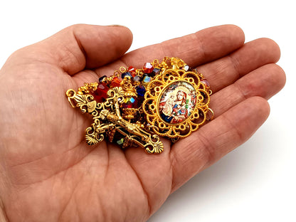 Our Lady of Perpetual Succour multi coloured faceted glass rosary beads with gold plated filigree crucifix.