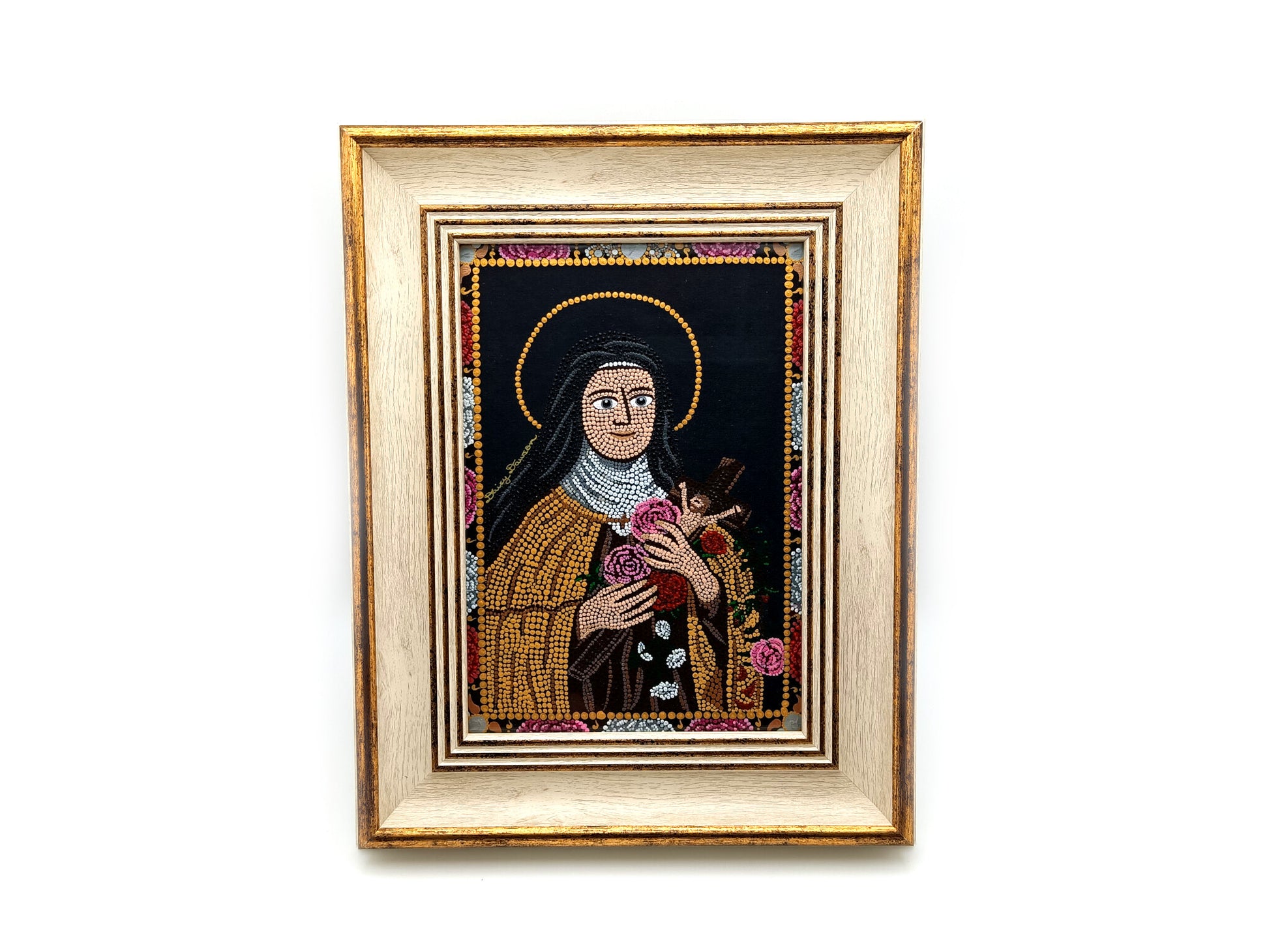 A framed religious mosaic icon portrait of Saint Therese of Lisieux, featuring a cream and gold-toned frame and a detailed multicolor mandala design on a white background.