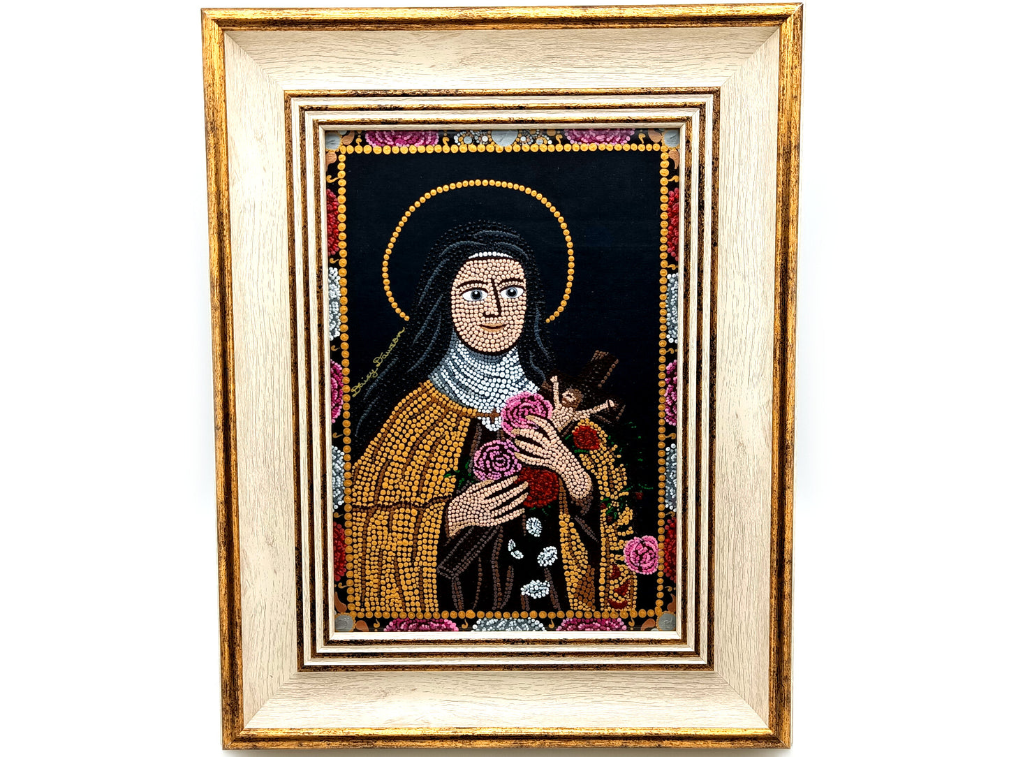 A framed religious mosaic icon portrait of Saint Therese of Lisieux, featuring a cream and gold-toned frame and a detailed multicolor mandala design on a white background.