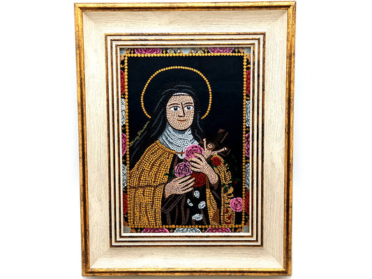 A framed religious mosaic icon portrait of Saint Therese of Lisieux, featuring a cream and gold-toned frame and a detailed multicolor mandala design on a white background.