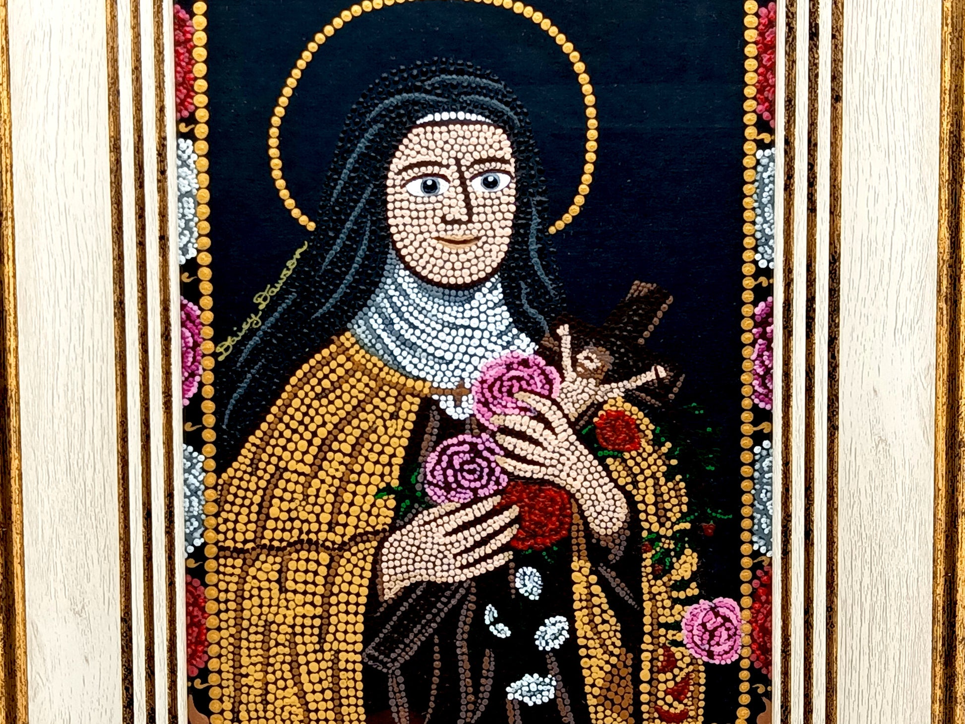 A framed religious mosaic icon portrait of Saint Therese of Lisieux, featuring a cream and gold-toned frame and a detailed multicolor mandala design on a white background.