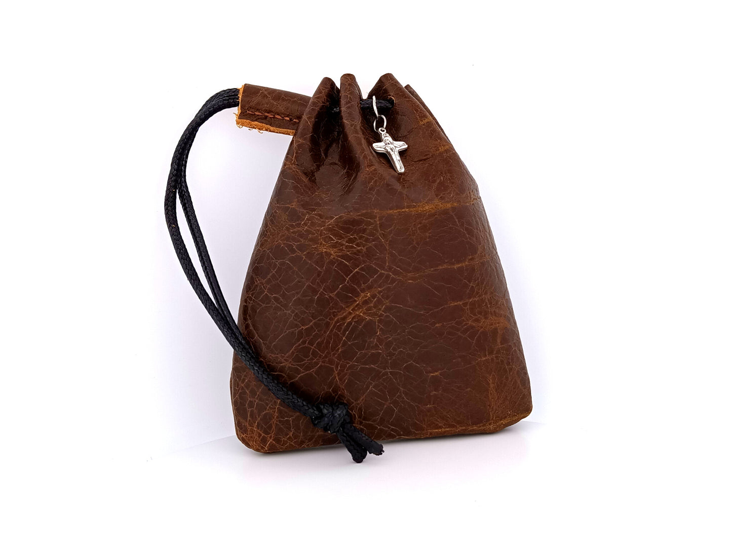 Real leather rosary pouch with draw string and small crucifix in nutmeg brown leather.